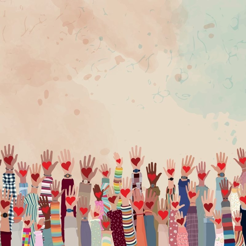 group of hands raised hands with hearts on palms